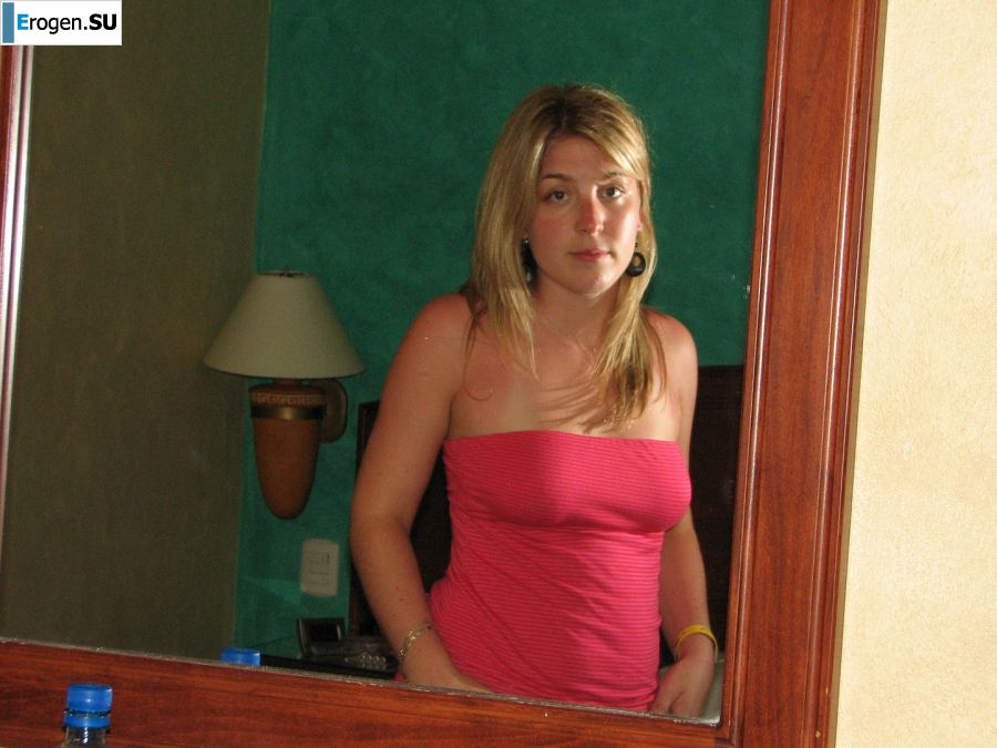 Charming blonde pulled down her blouse and bared boobs. Photo 11