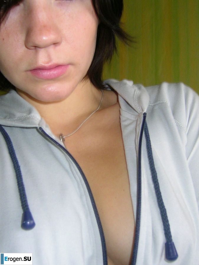 A naughty brunette with small breasts poses at the mirror. Photo 8