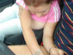 An appetizing busty chick took off her blouse and jeans in a car. Thumb 15