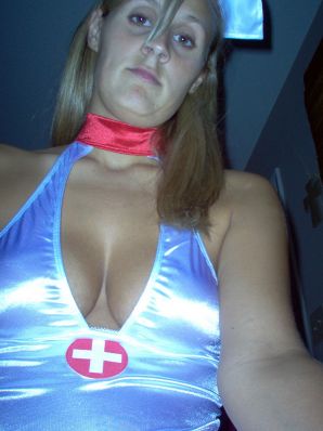 Seductive nurse masturbates on the couch. Thumb 32