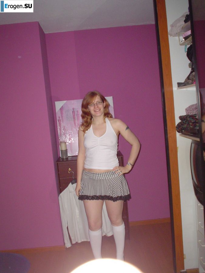 A red-haired student with glasses spread her legs in lace stockings and showed a pussy. Part 2. Photo 30