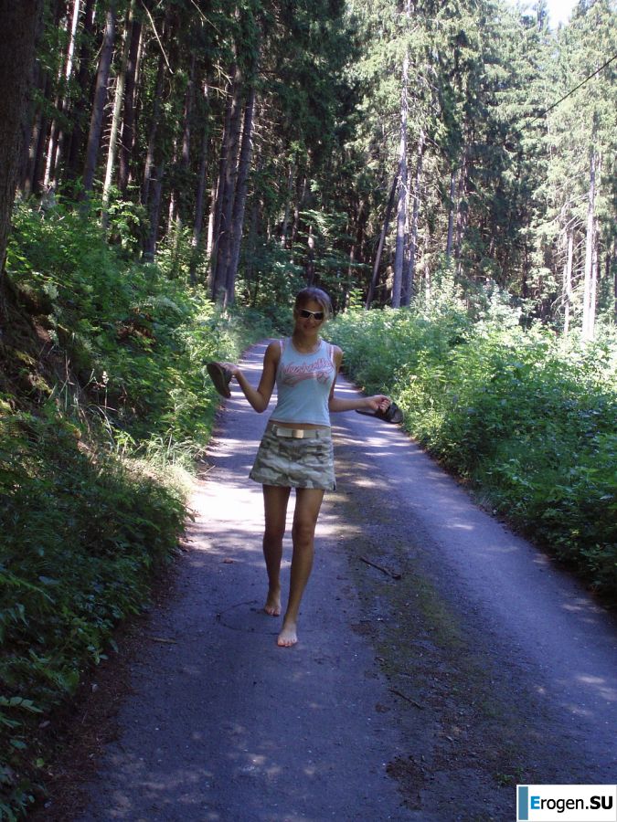 A woman caresses herself spreading her legs apart on the camera. Part 2. Photo 14