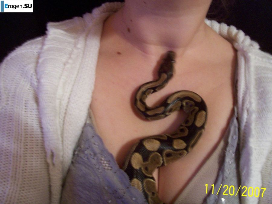 Passionate minx dances striptease in nature with a snake. Photo 44