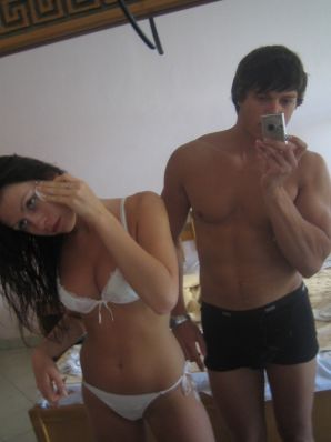 A slender woman at the sea took off a white swimsuit in front of her husband. Thumb 35