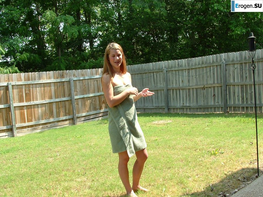 A blonde with a beautiful figure poses naked on the lawn. Part 4. Photo 19