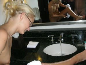 A pretty blonde is laid bare in the toilet and spreads her legs in bed. Part 4. Thumb 7