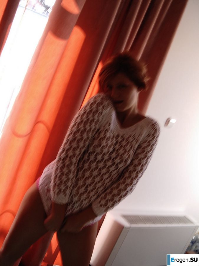 Naughty red-haired girl in pink panties fingering nipples. Photo 21