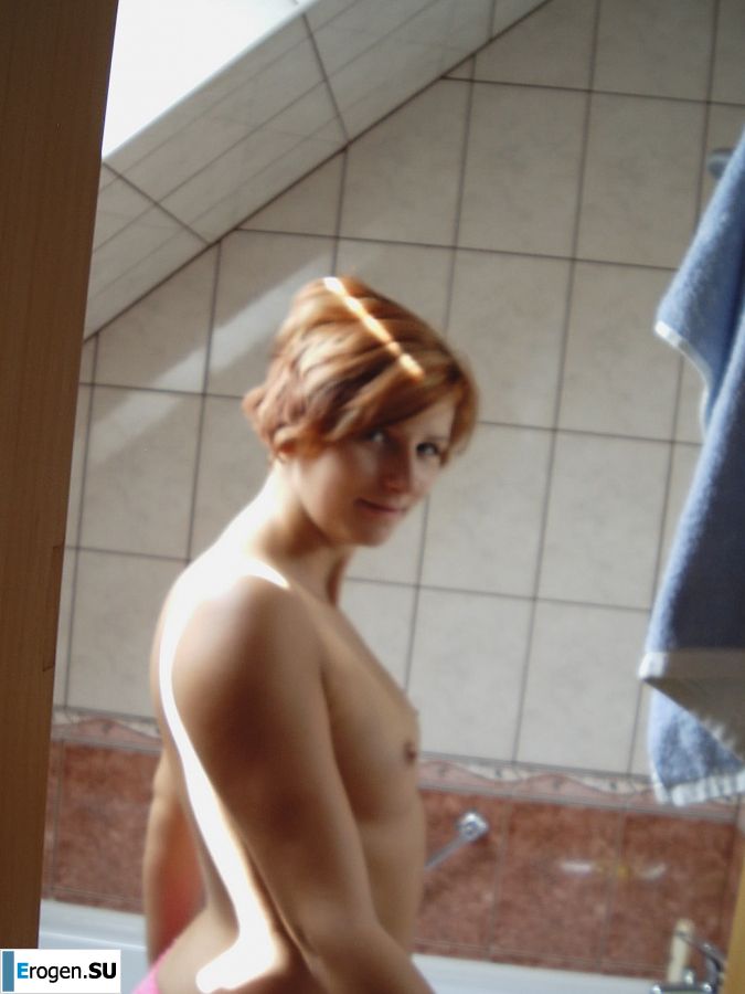 Naughty red-haired girl in pink panties fingering nipples. Photo 7