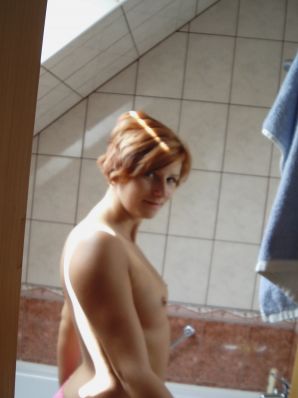 Naughty red-haired girl in pink panties fingering nipples. Thumb 7